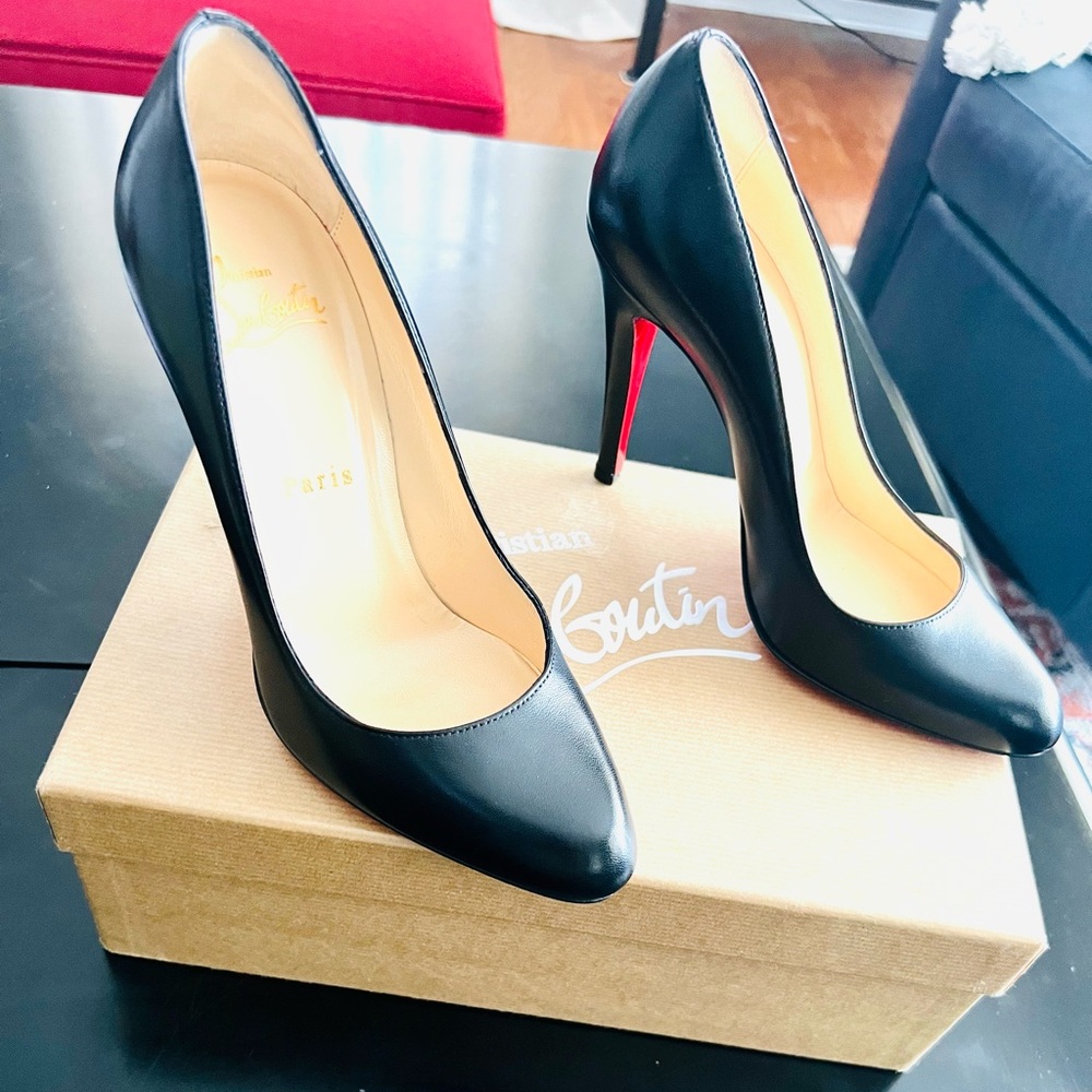 Women’s classic black Louboutin pumps.